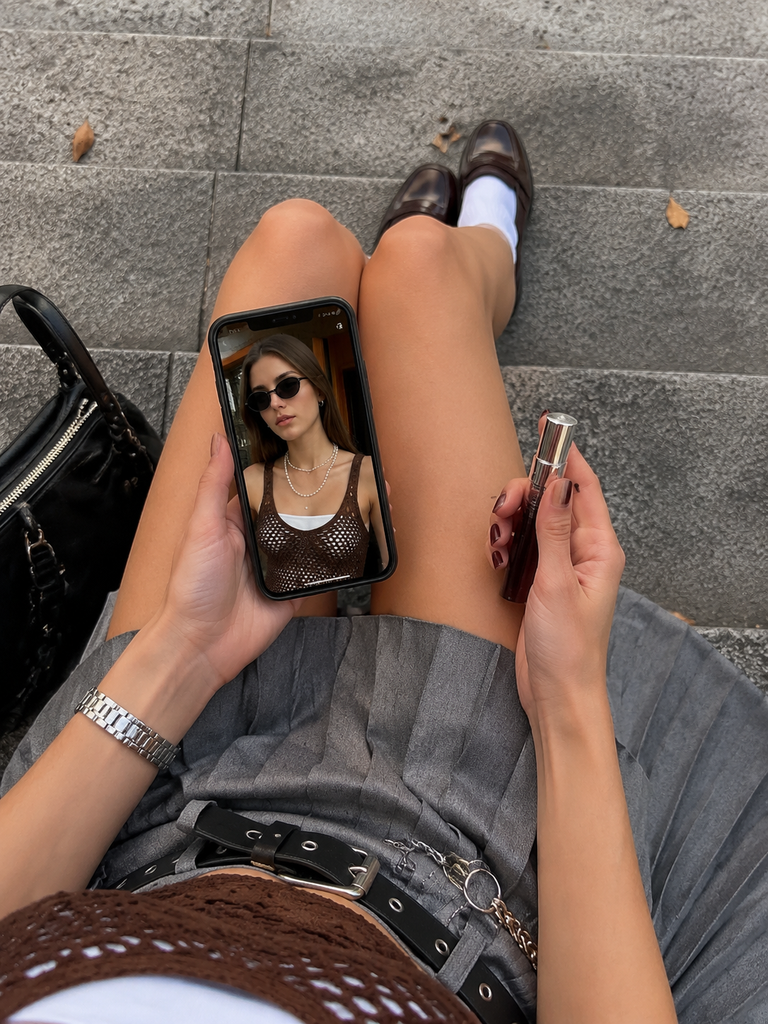 AI-generated top-down Instagram influencer photo with a smartphone and beauty product