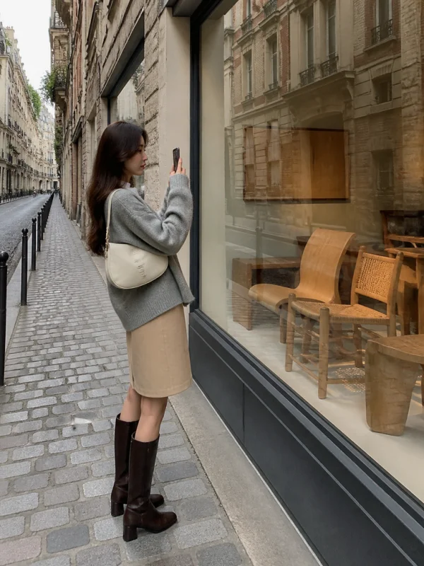 AI fashion model photographing a furniture gallery window in Paris