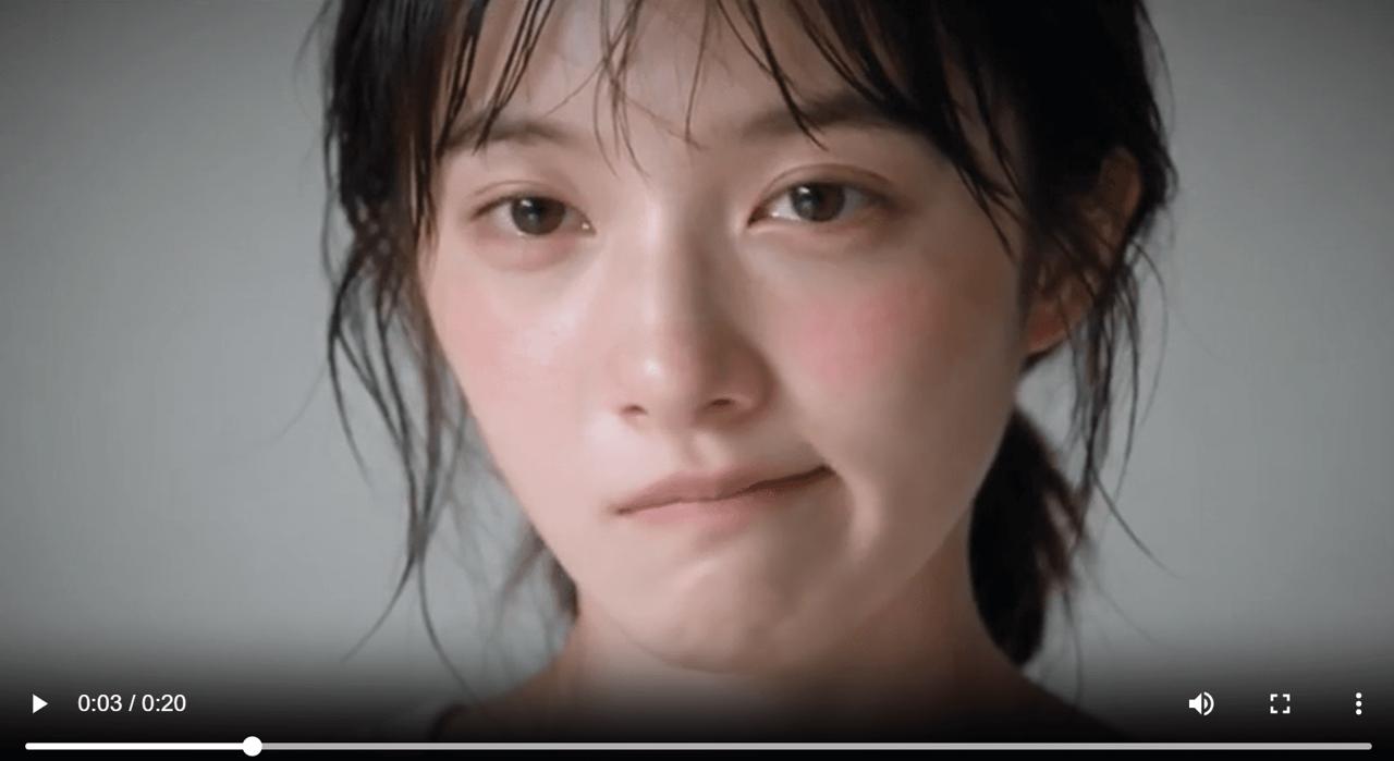 Close-up from a Seedance 2.5 micro-expressions test showing a woman pressing her lips together while trying not to smile