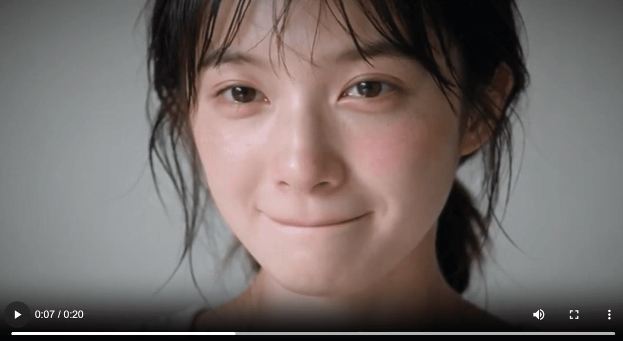 A restrained smile begins to appear as the woman’s eyes brighten during a Seedance 2.5 facial-expression test