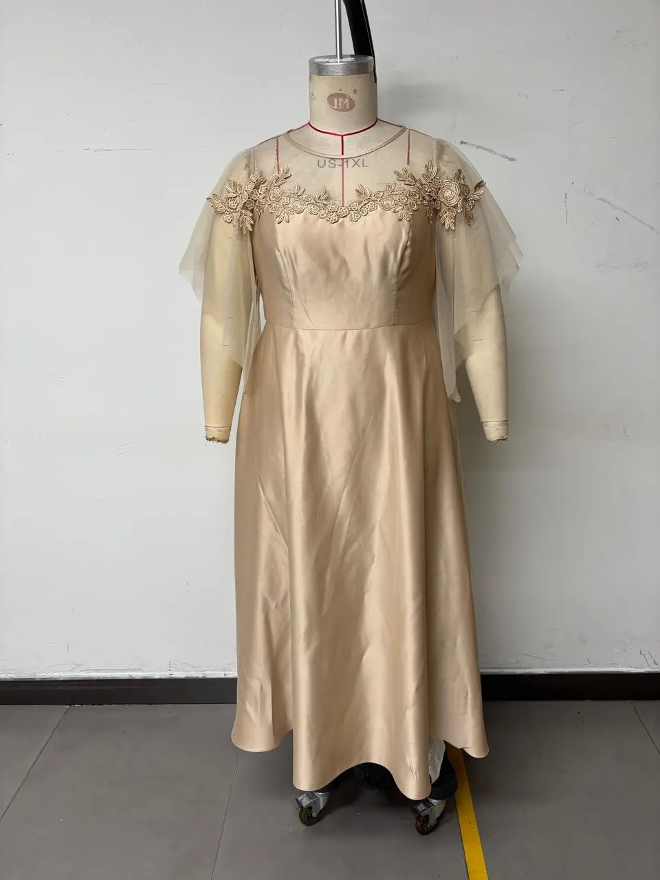 Champagne satin dress on a mannequin used as the garment reference