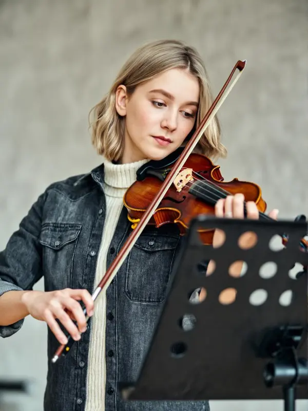 A girl is playing the violin.