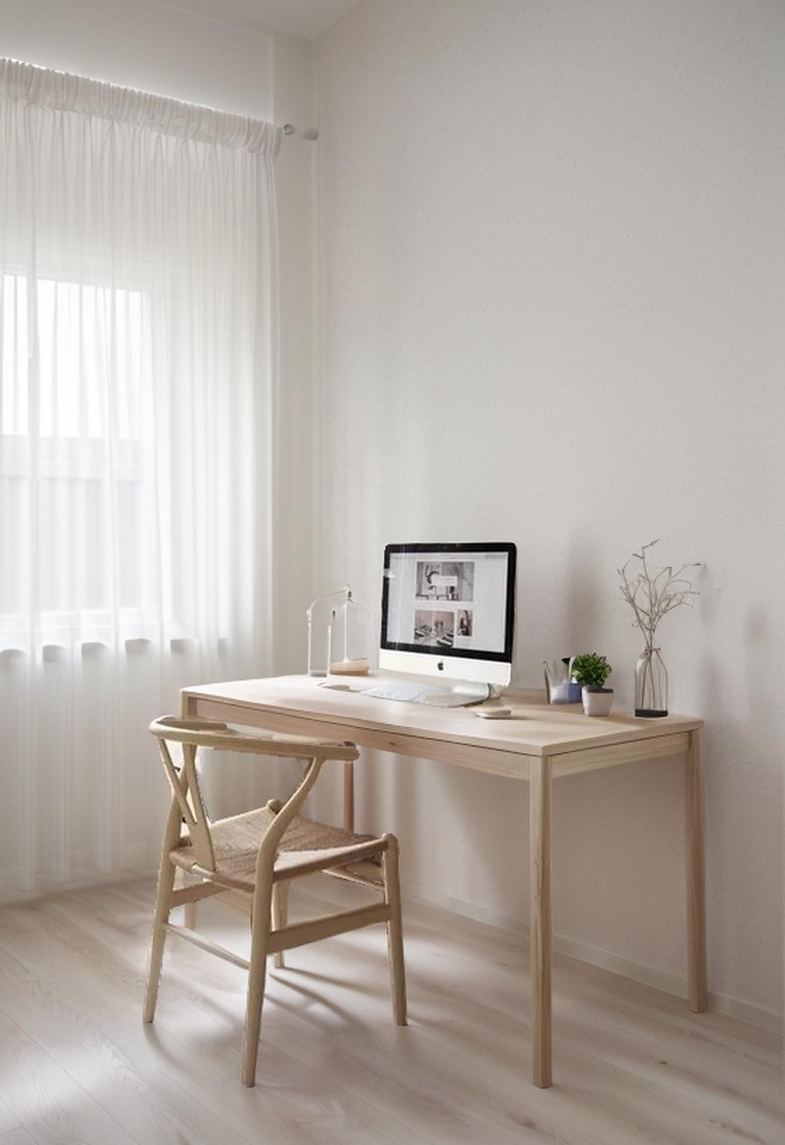 A Minimalist Home Office With Natural Light And A Clean Organized Desk Setup
