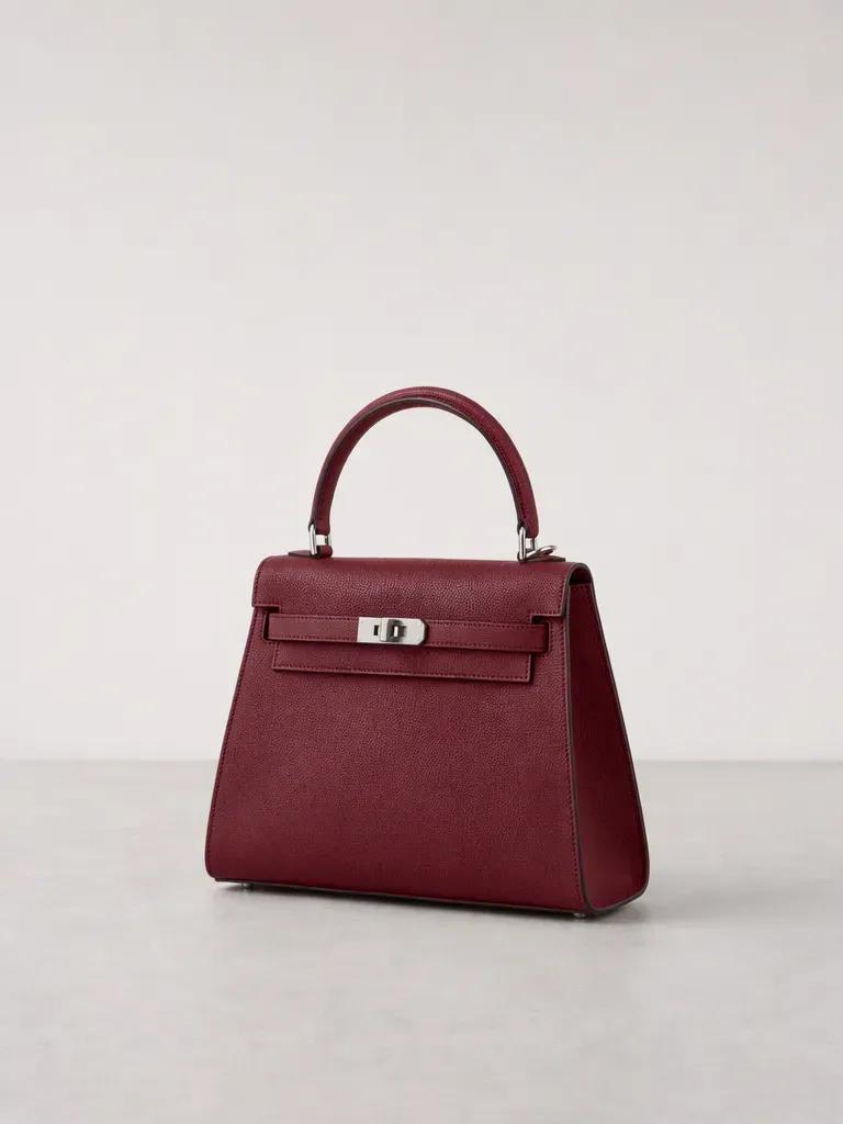 Oxblood red handbag product recoloring result